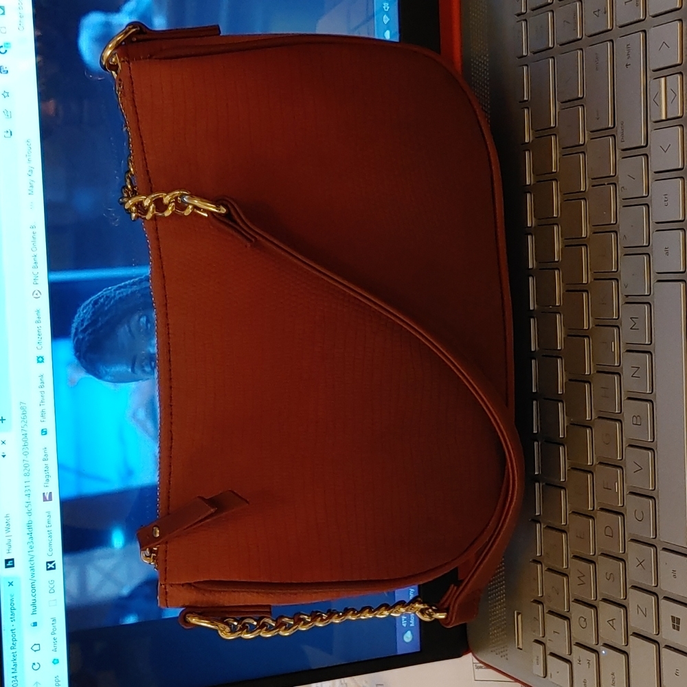 Designer (I.N.C) Mini handbag in Burgundy. Never, ever carried it! Cute!